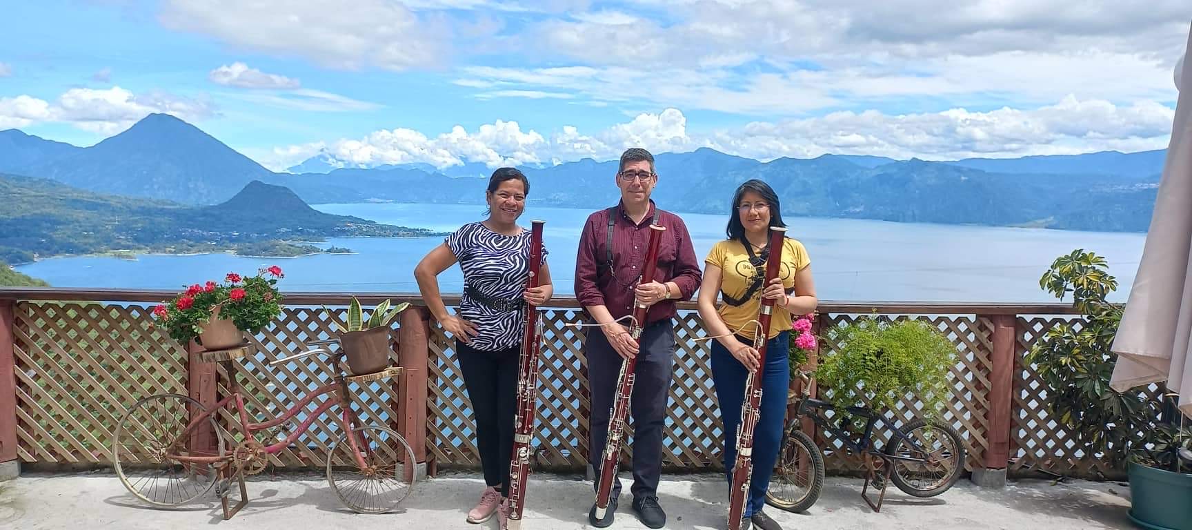 Benjamin Coelho in Guatemala with other bassoonists with mountainous landscape in back