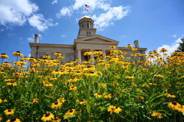 Old Capitol/UI campus in July with flowers