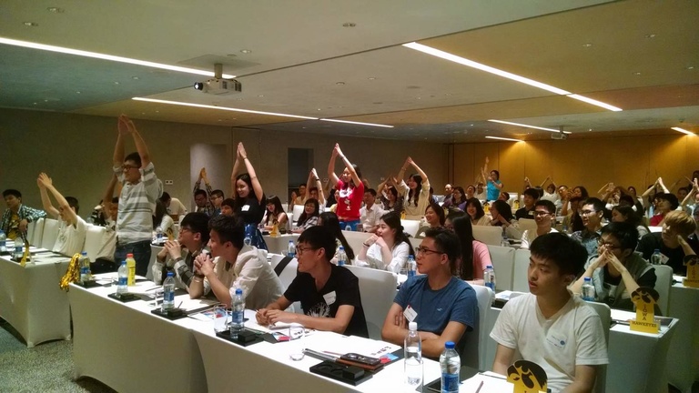In June, orientation events like this one were held in the Chinese cities of Beijing and Shanghai for international students headed to the University of Iowa in fall 2016. Here, several students form the “I” during the I-O-W-A chant.