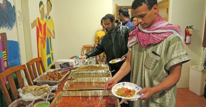 UI junior Abdualrahman Ismail is able to eat after sunset during Ramadan at the Asian Pacific American Cultural Center on Tuesday, June 14, 2016. During Ramadan strict fasting is observed as a way to practice reflection, discipline, and devotion.