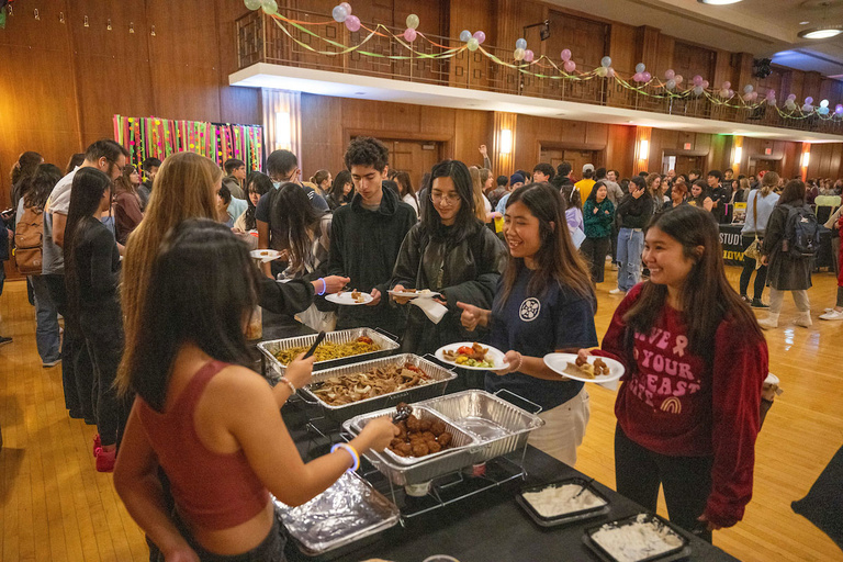 students getting food in line in the IMU international ballroom