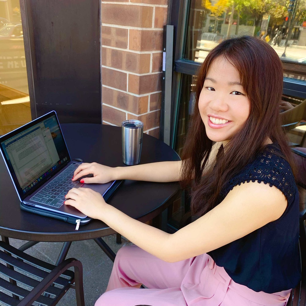 Linette Leng sitting at computer