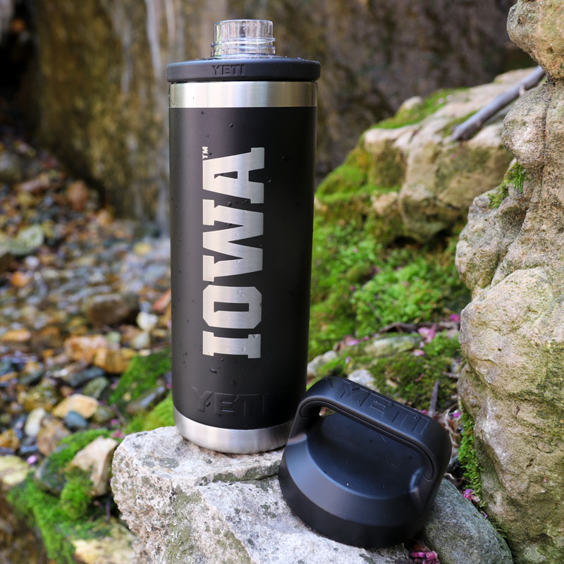 YETI water bottle with IOWA on side near waterfall