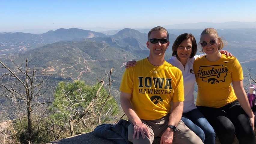 Student with parents in Barcelona wearing Hawkeye shirts