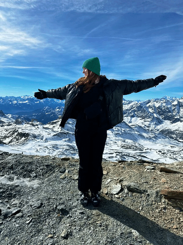 Olivia Miller on mountain in Switzerland