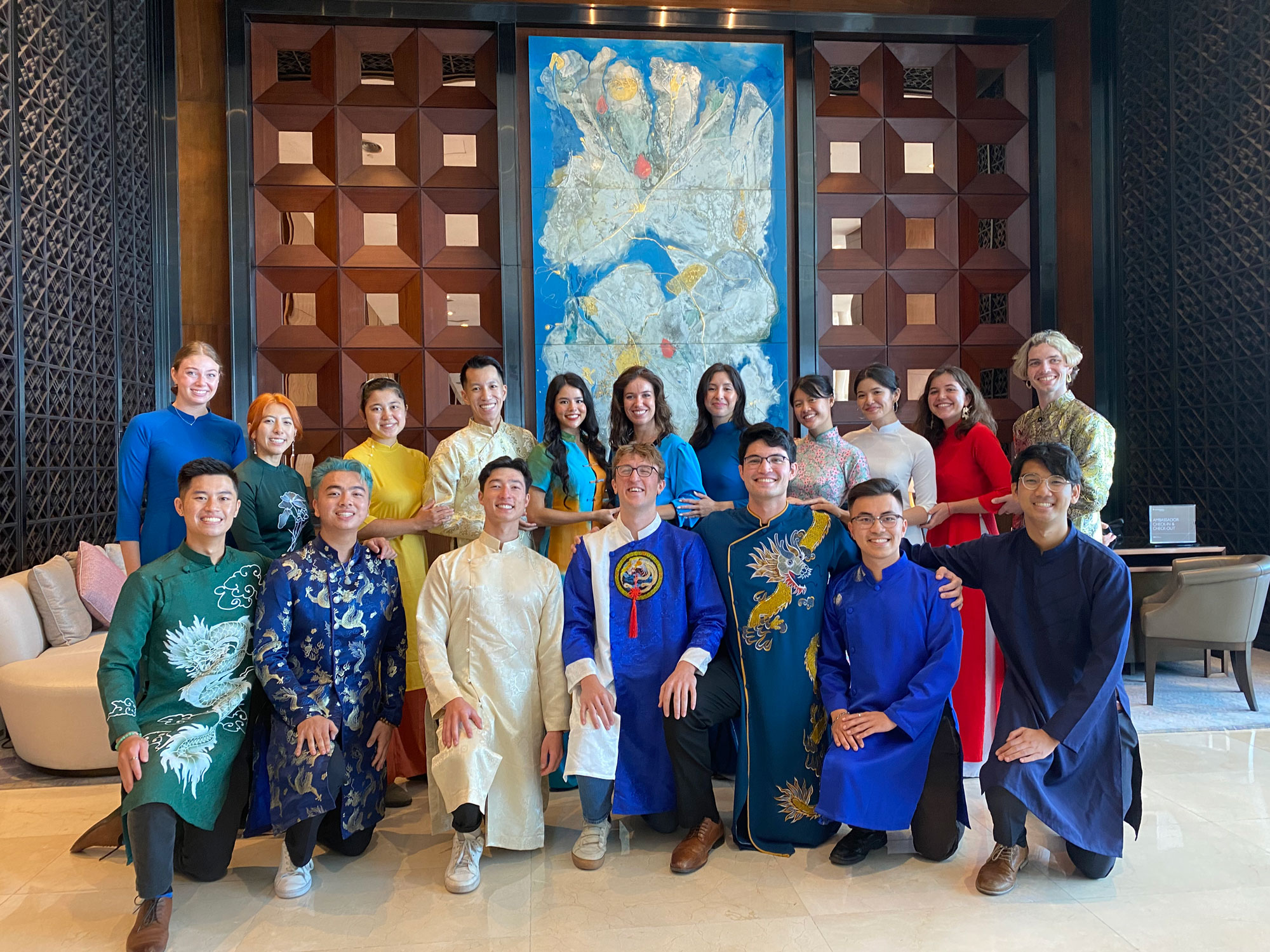 Megan Lederman with a group in Vietnam dressed in traditional dress