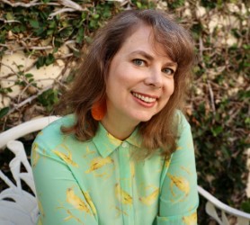 Kathleen Maris Paltrineri green sweater, headshot