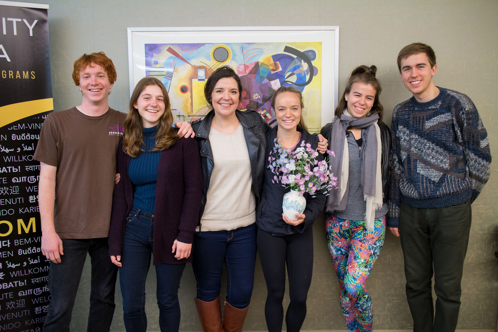 group of people standing together in an office