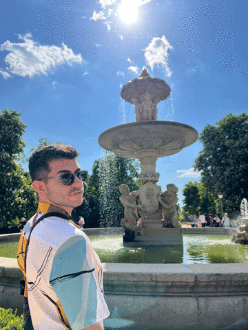 Kevin Drahos in front of a fountain