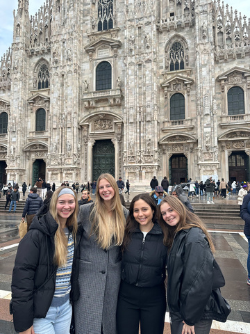  Molly McNeill (left) pictured with new friends in Milan, Italy
