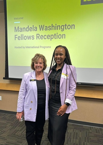 President Barbara Wilson poses in photo with a Mandela Washington Fellows.