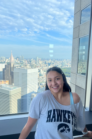 Lucy in front of a window in Tokyo