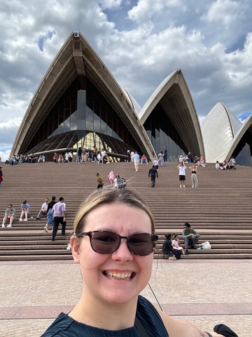 Chealsa in front of the Sydney opera house