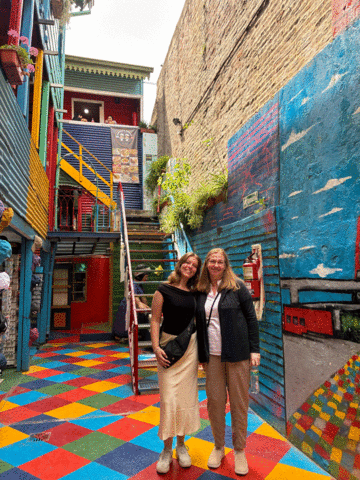 Kara Juhl and Autumn Tallman standing on colorful street in Buenos Aires