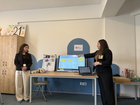 UI graduate students Camila Bonta and Paulina Garza Rodriguez share educational presentation on communication strategies at local non-profit Down Syndrome Kosova in Pristina, Kosovo.