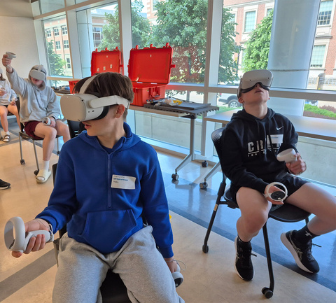 students with vr headsets on in classroom