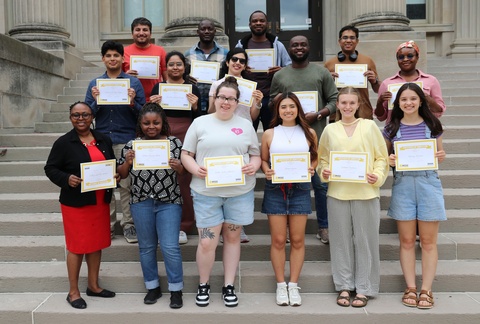Students holding their Bridge certificates