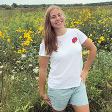 student smiling in field