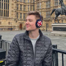 student wearing earmuffs with British flags