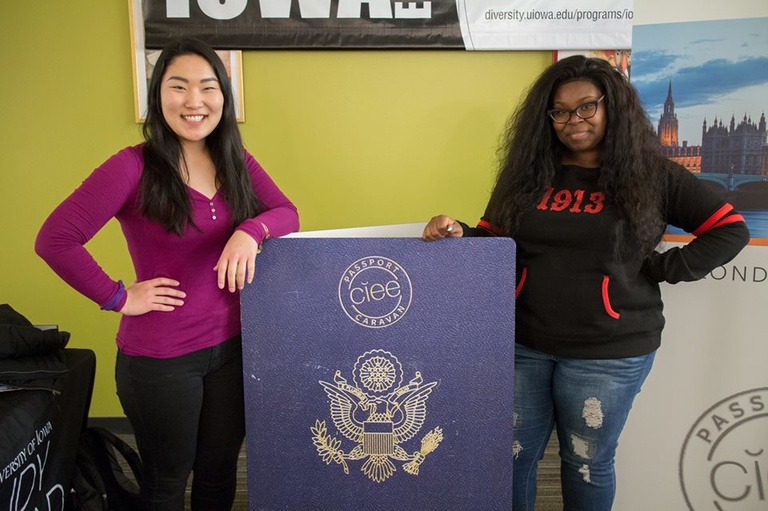 students with giant passport
