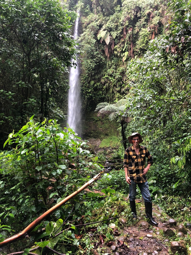 Anthony Young standing in tropical forest in Ecuador