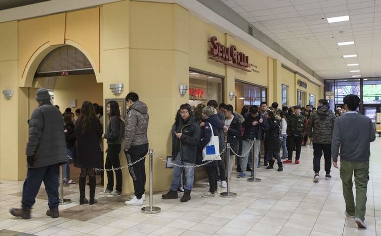A line extends around the corner of Seoul Grill at Old Capitol Town Center in Iowa City on Wednesday, Jan. 25, 2017. Several of the businesses in the mall are owned by Asian-Americans, which has created a business microclimate unique in Iowa. (Rebecca F. 