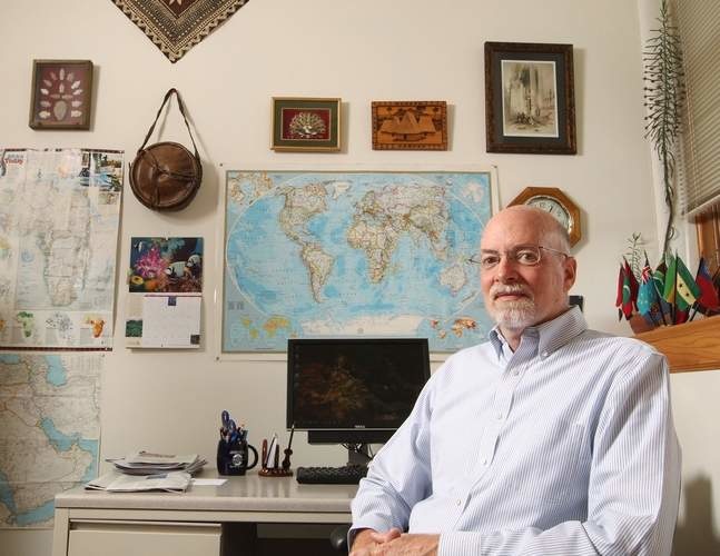 Ambassador in Residence Ron McMullen sits in at his office in Schaeffer Hall on the University of Iowa campus in Iowa City on Thursday, June 8, 2017 surrounded by mementos of his over-30-year career as a diplomat. McMullen was the ambassador to the Africa