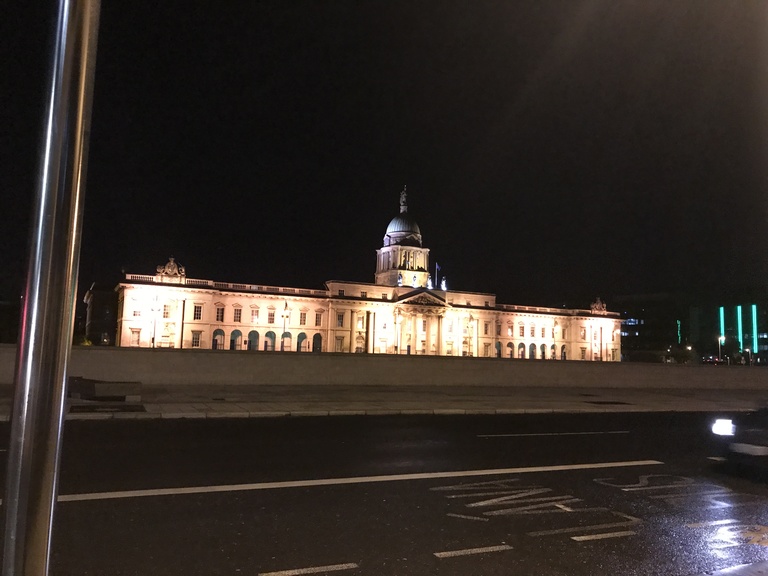 My first time experiencing Dublin at night with just a friend and some good vibes. (picture of the cool looking building at night)