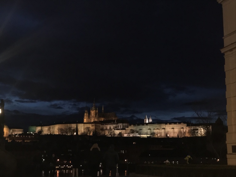 Prague Castle lit up at night - view from Charles Bridge