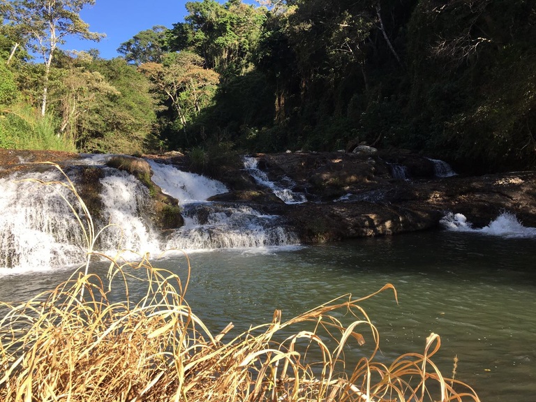Sitting on top of a waterfall, looking downstream at the Costa Rican forest.  One of the many waterfalls that I fell in love with near my city of San Ramon. 