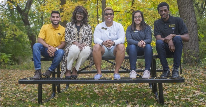 From left: Jesus Payan, VP for Student Life Melissa Shivers, Tab Wiggins, Prisma Ruacho, and Jamal Nelson sit outside the Asian Pacific American Cultural Center during an interview with Shivers and leaders from the UI cultural and resource centers on Frid