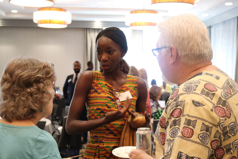 Mandela Washington Fellow Awa Thiam, of Dakar, Senegal, speaks with members of the Council for International Visitors to Iowa Cities (CIVIC) at a meet and greet reception on June 25