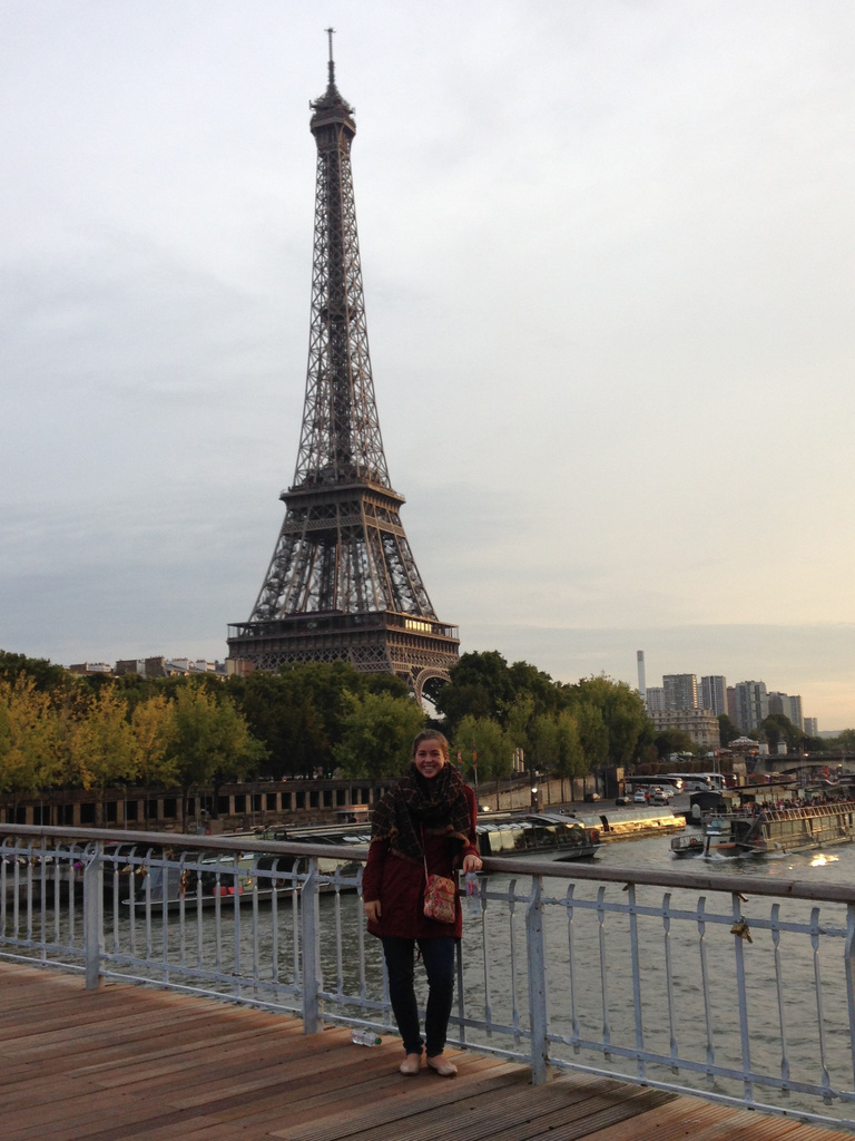 UI Alumna Mila Brassart posing in front of the Eiffel Tower