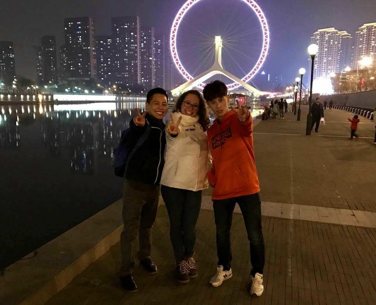With Longsheng (left) and Shitou (right) in front of the Eye of Tianjin.
