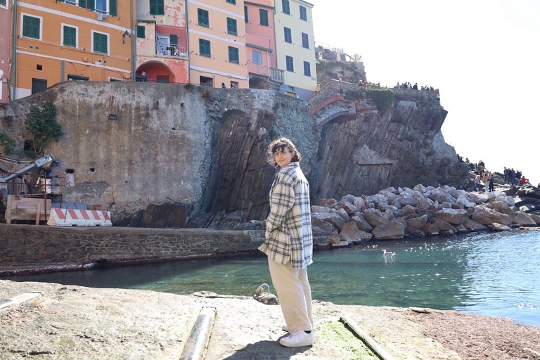 Leah Cooke standing by water in Italy