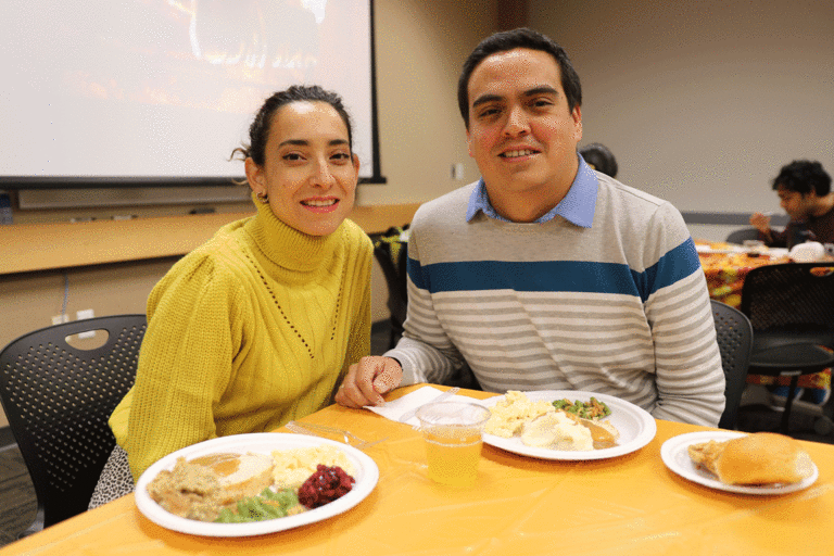 two people sitting at table