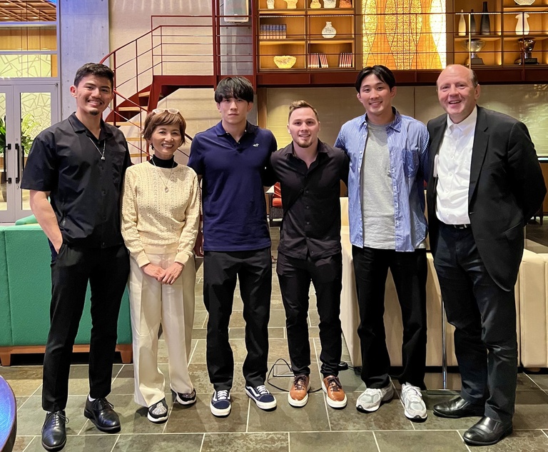 John Lemkuil and his family smiling with Keisuke Otoguro
