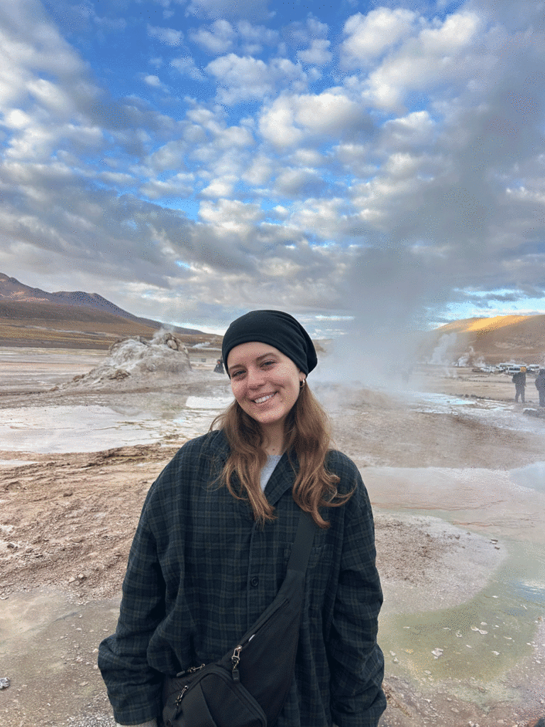 Kara Juhl in front of geysers in San Pedro de Atacama in Chile