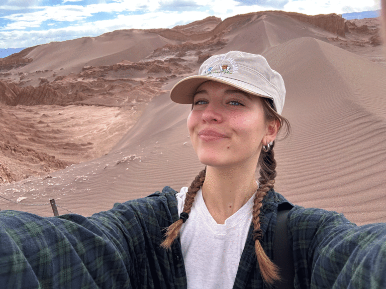 Kara Juhl in front of sand dunes in San Pedro de Atacama, Chile