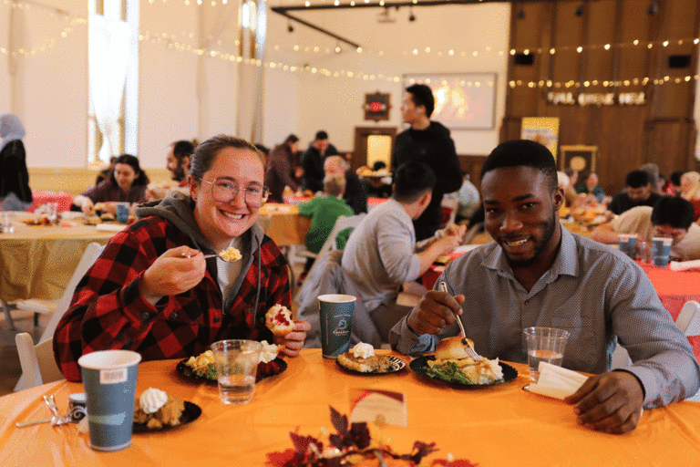 two students eating food