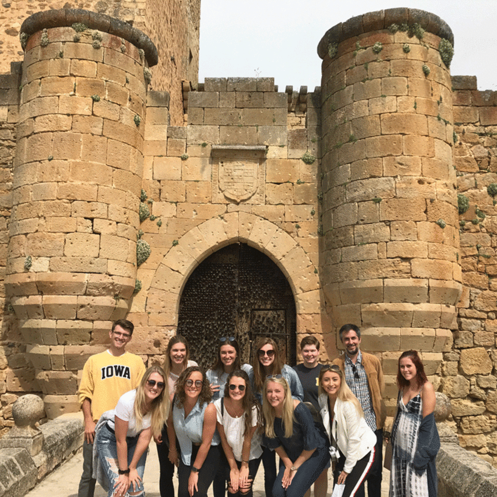 cultures of spain faculty led group in front of castle
