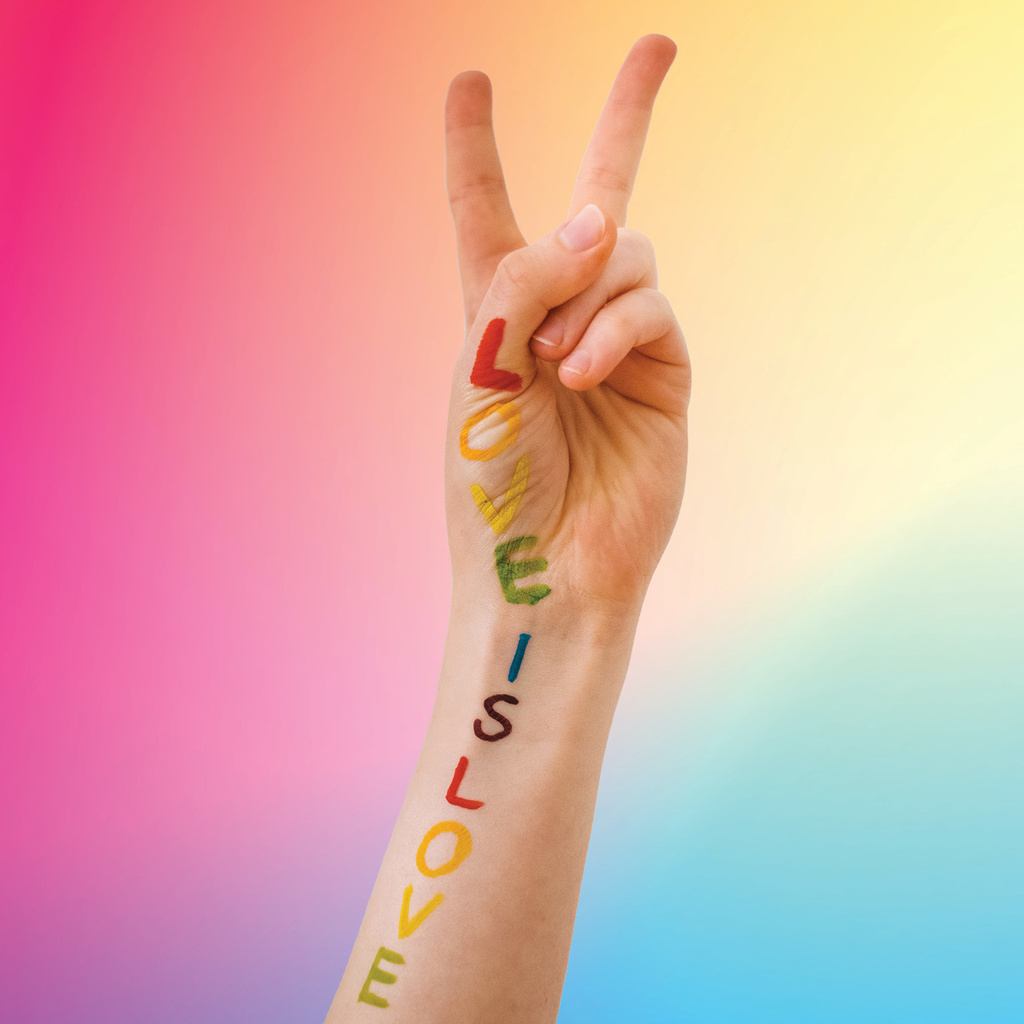 hand with love is love with rainbow background
