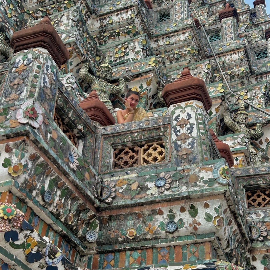 Student looking down from temple in Bangkok