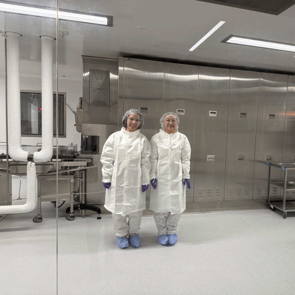 students in protective garb in lab