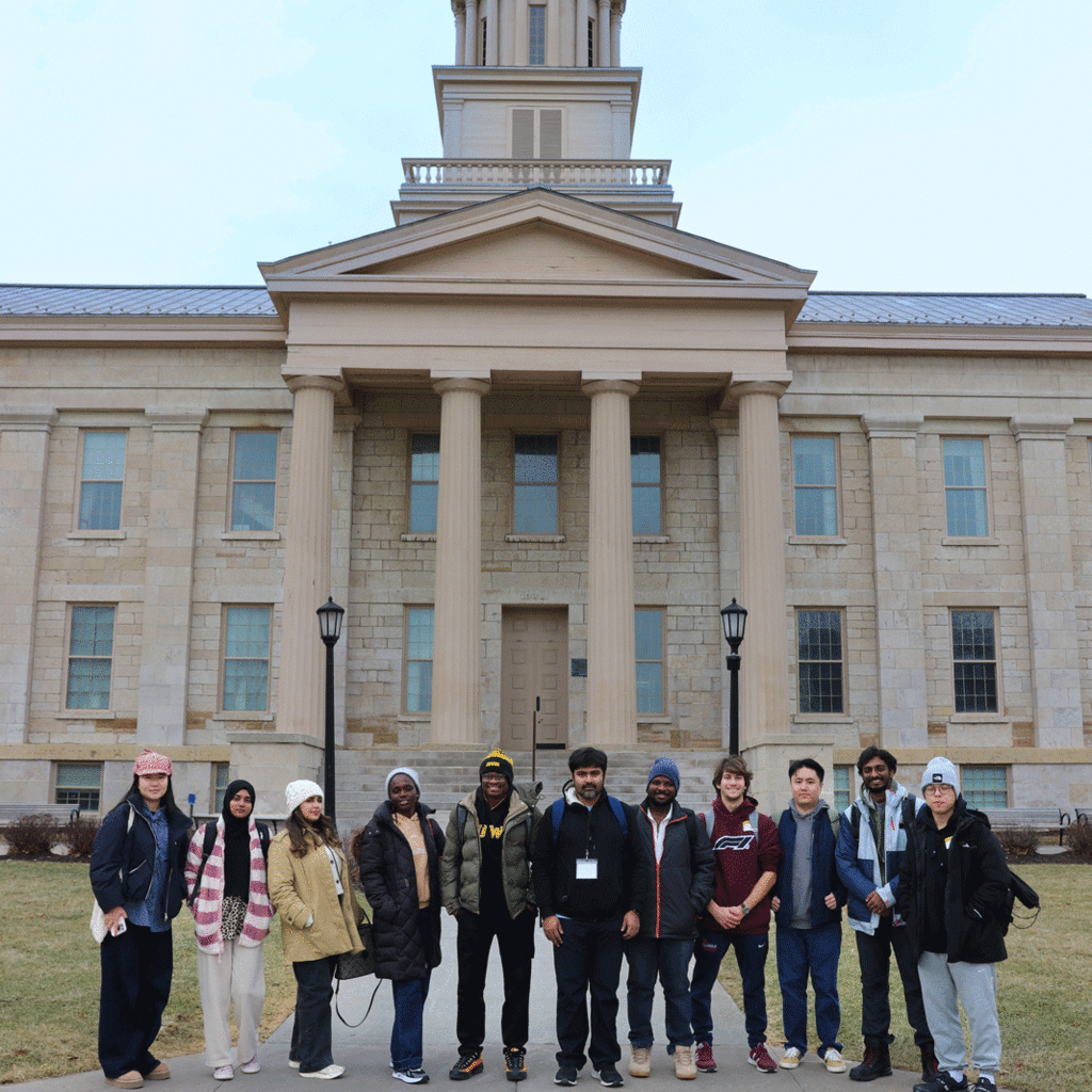 international students standing in front of Iowa Old Capitol building