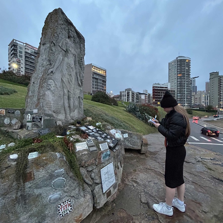 Cecilia Bradley visiting Alfonsina Storni's memorial in Argentina
