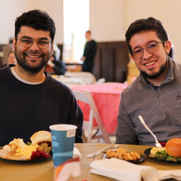 two people enjoying the fall break meal