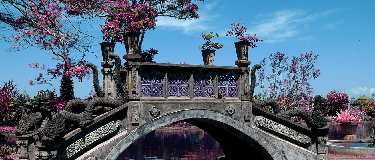bridge in Indonesia with dragons and flowered trees