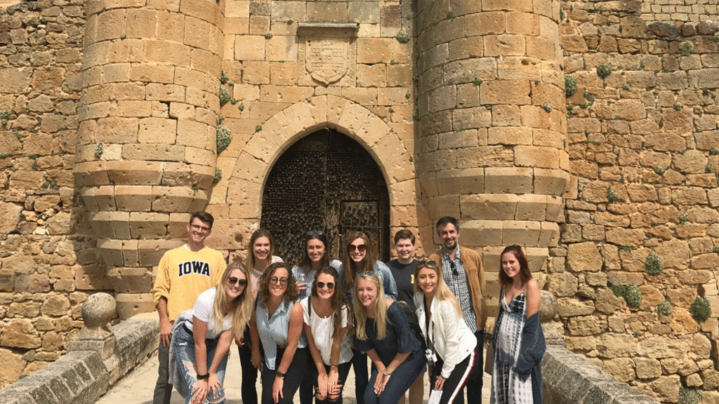 cultures of spain faculty led group in front of castle
