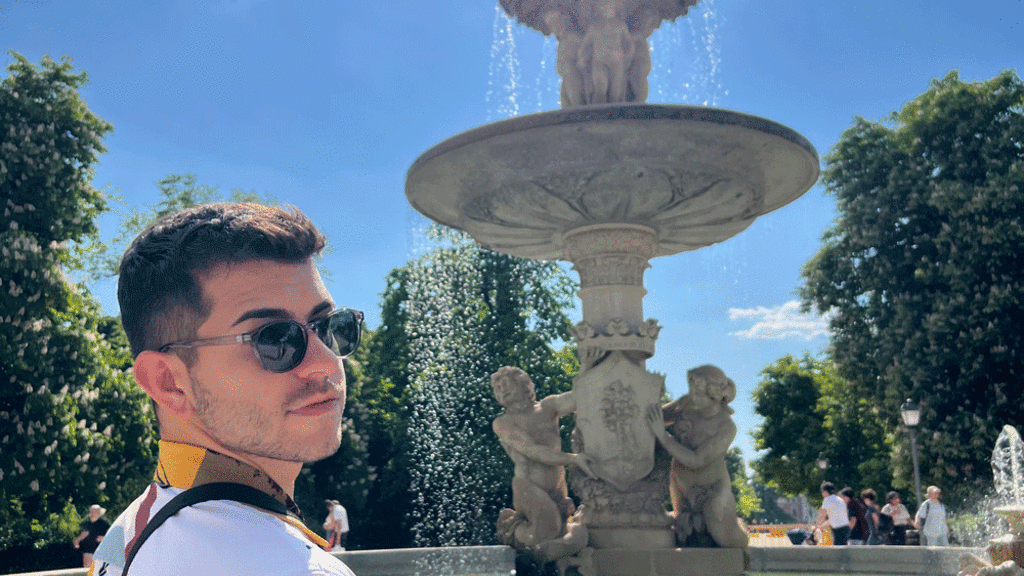 Kevin Drahos in front of a fountain